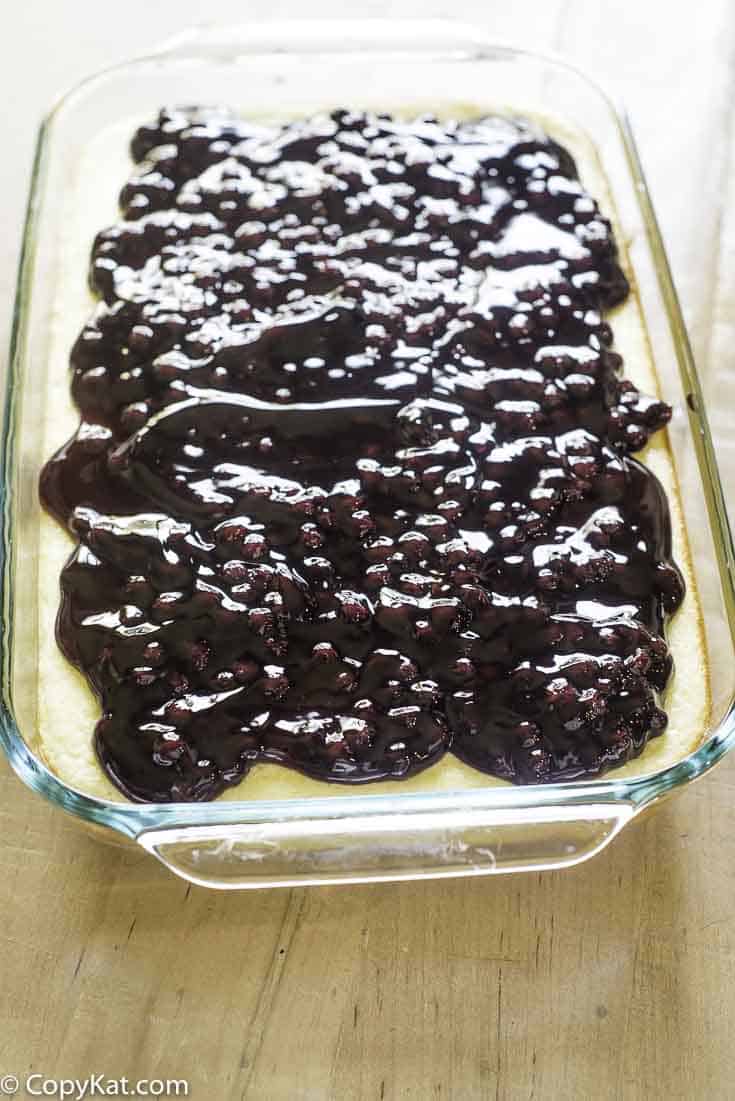 a pan of blueberry cheesecake bars