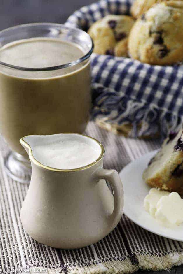 french vanilla coffee creamer with a cup of coffee and blueberry muffins