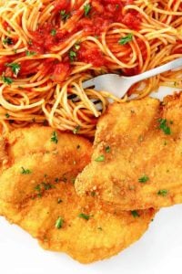 Romano cheese crusted chicken and pasta with marinara