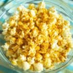curry popcorn in a glass bowl