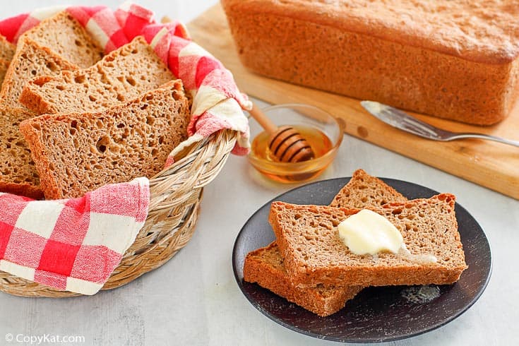 homemade fluffy whole grain wheat bread slices and loaf