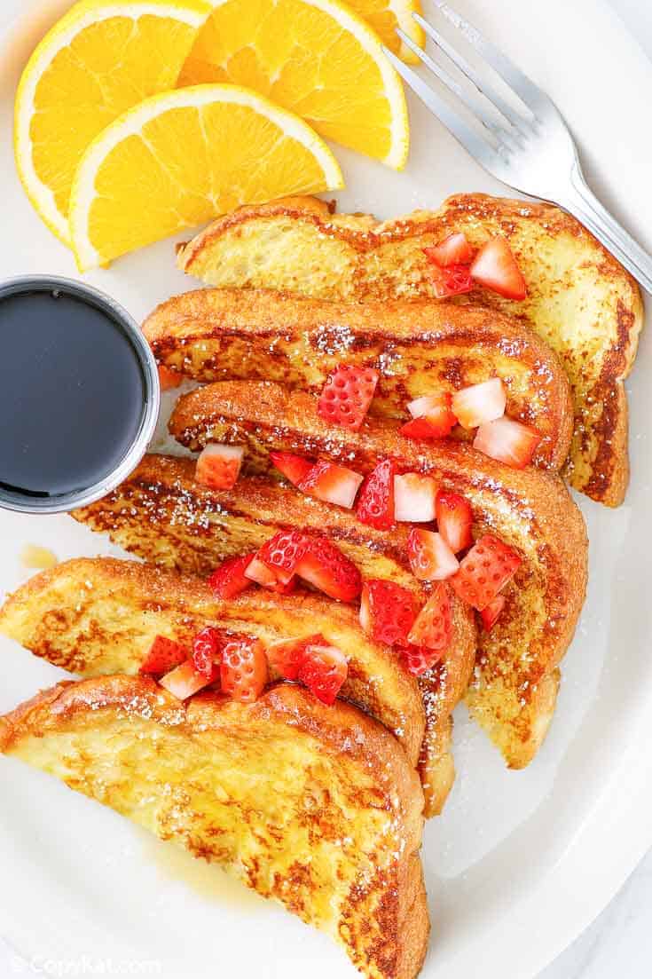 french toast with chopped strawberries on top.