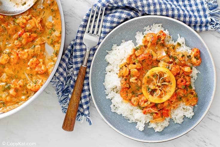 crawfish etouffee over white rice and in a pan