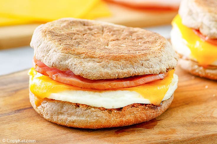 an egg white breakfast sandwich with Canadian bacon and cheese