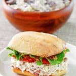 homemade Newks chicken salad in a sandwich and a bowl