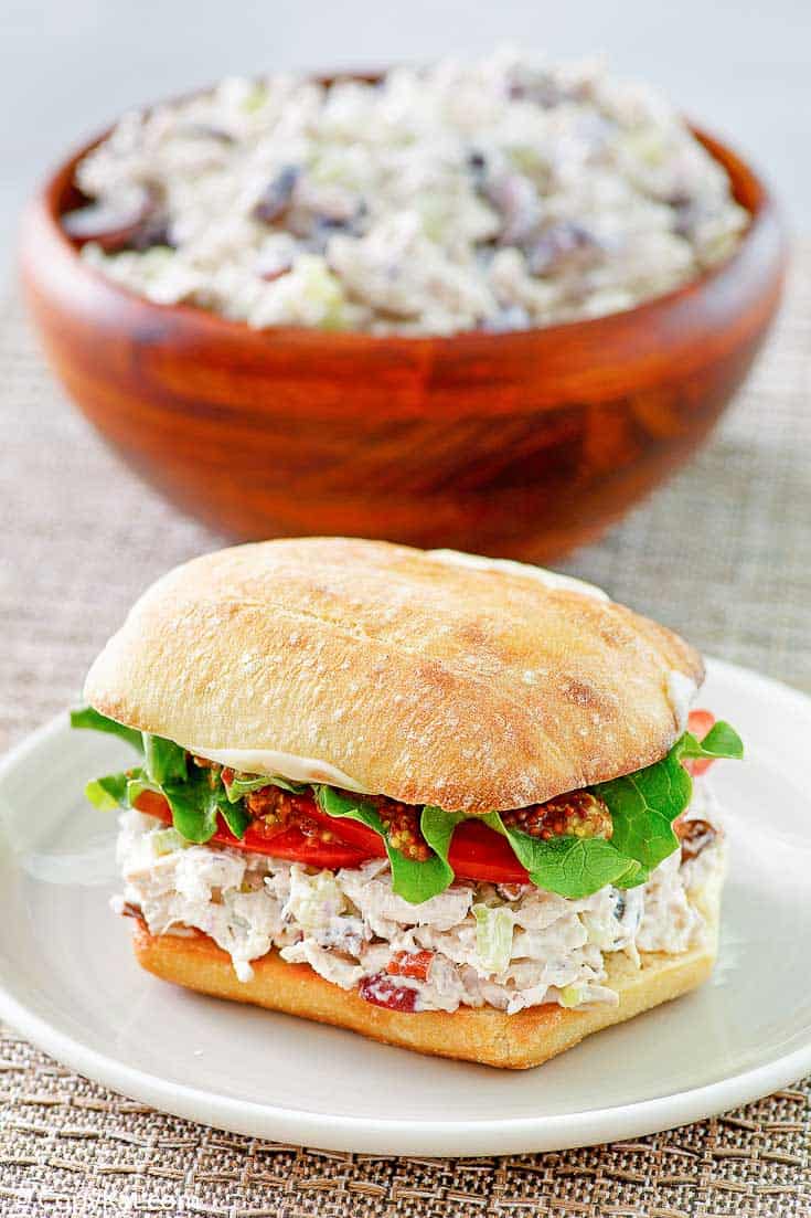 homemade Newks chicken salad in a sandwich and a bowl