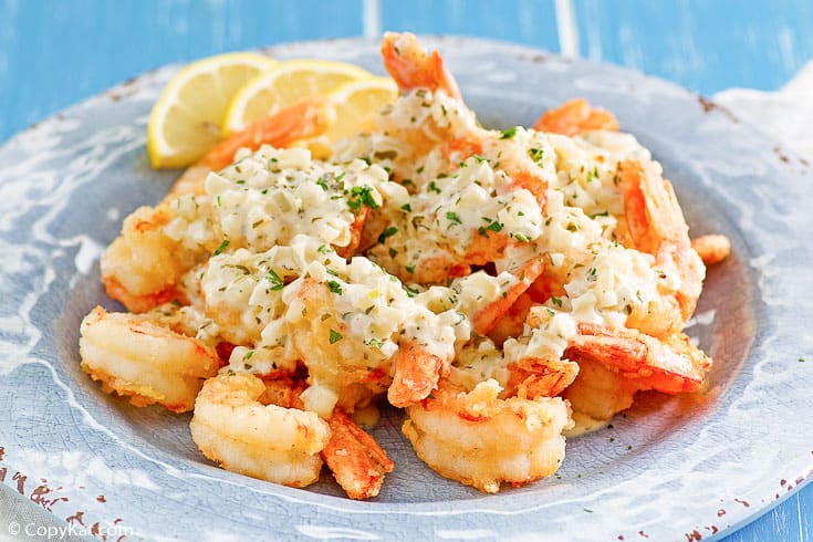 homemade Olive Garden classic shrimp scampi fritta on a light blue plate