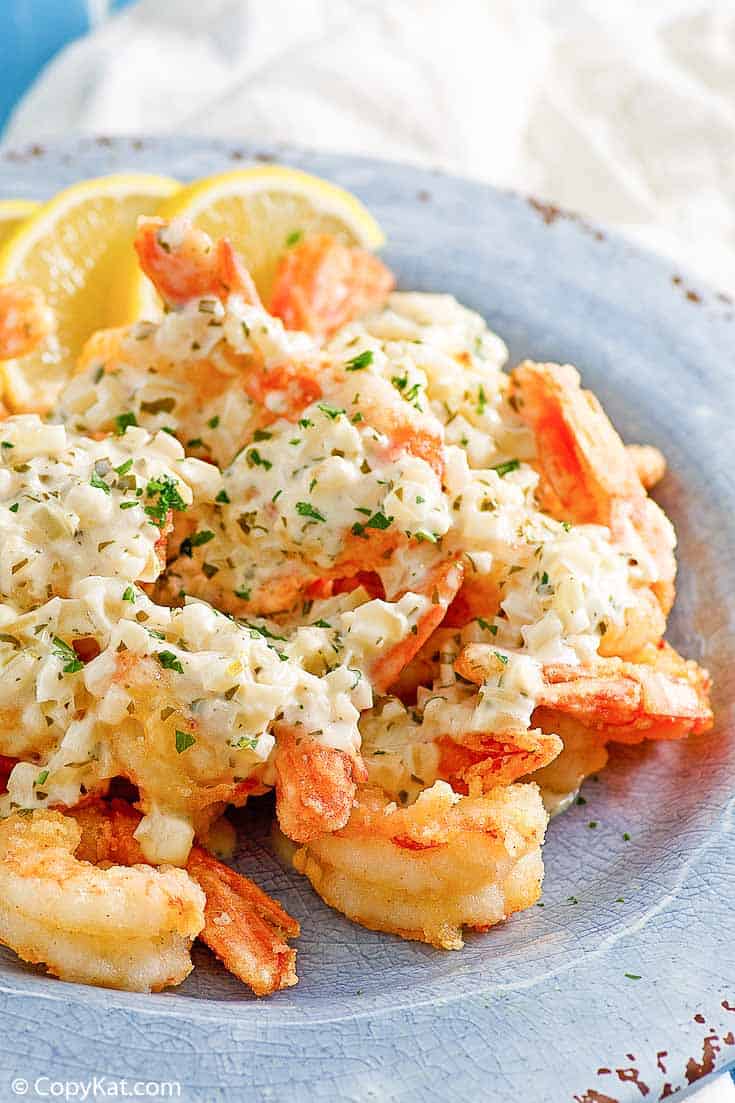 homemade Olive Garden classic shrimp scampi fritta on a blue plate