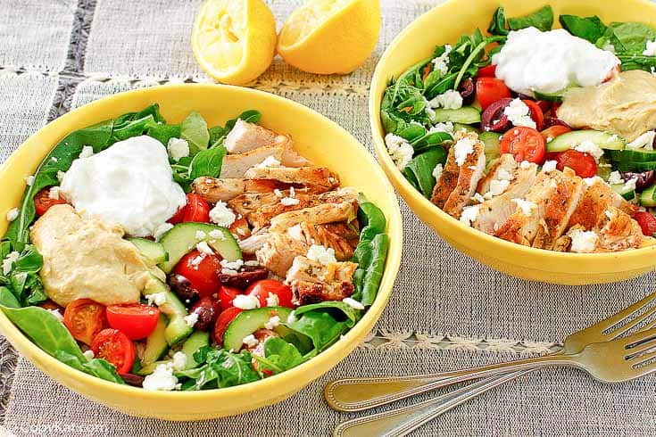 two bowls of homemade Panera Mediterranean grain bowls with chicken