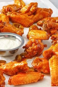 homemade Pluckers hot wings and dressing on parchment paper