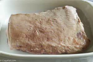 corned beef placed fat side up in a pan