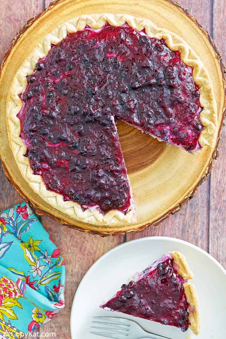 blueberry cream cheese pie and a slice of the pie on a plate