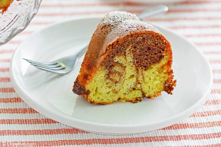 a slice of chocolate pistachio swirl bundt cake