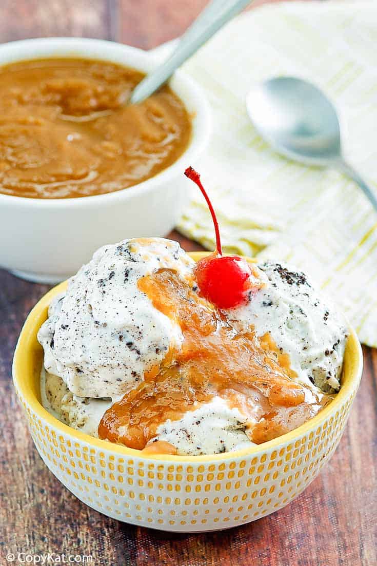 peanut butter sauce on top of ice cream in a bowl