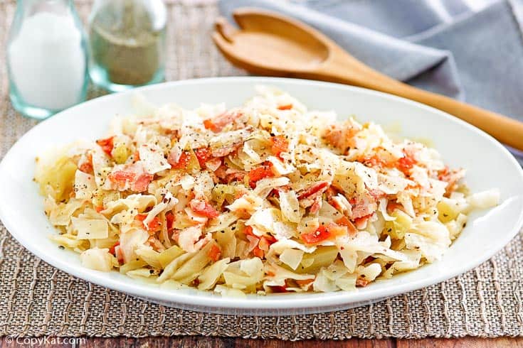 skillet cabbage with bacon on a white serving platter