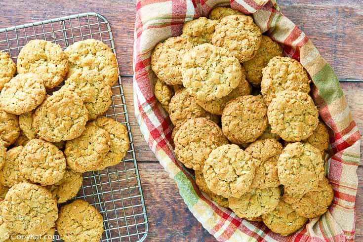 oatmeal coconut crunchies cookies in a basket and on a wire rack