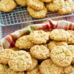 oatmeal coconut crunchies cookies in a basket and on a wire rack