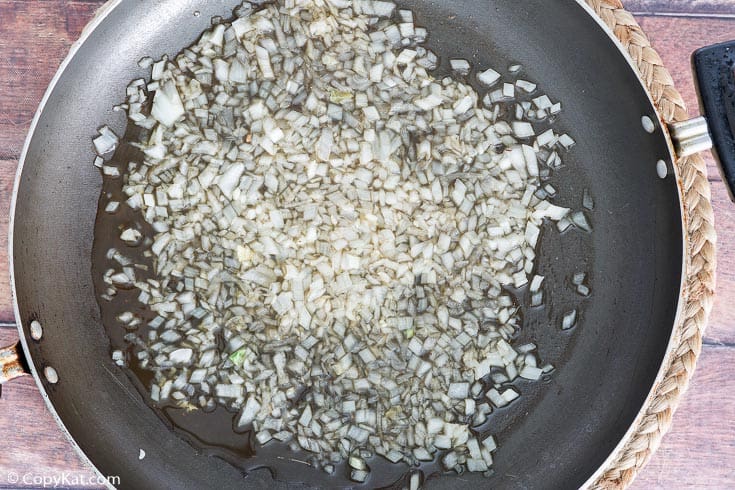 cooked chopped onions in a skillet