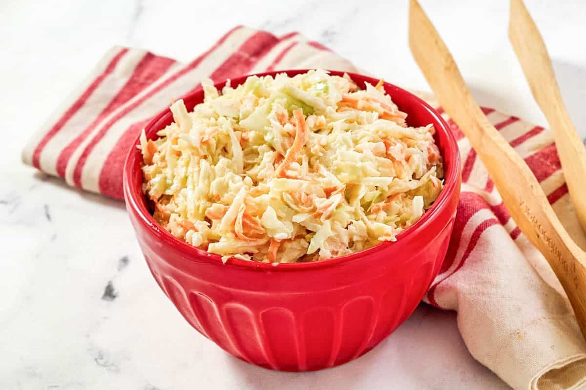 Chopped cabbage, carrot, and onion slaw with creamy dressing.