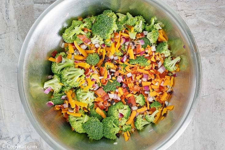 broccoli salad ingredients in a mixing bowl