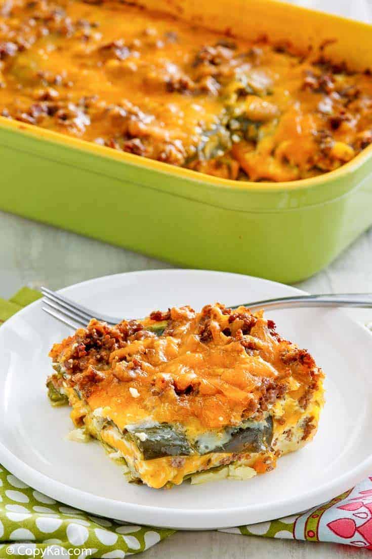 a serving of chili relleno casserole with beef in front of the casserole