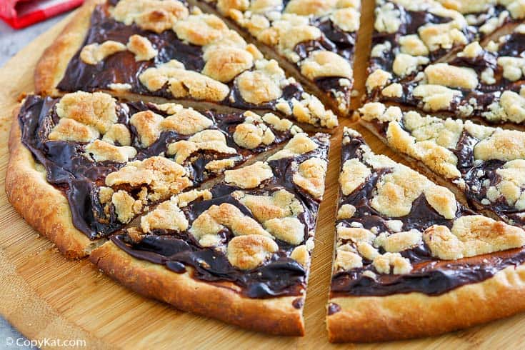slices of chocolate dessert pizza on a pizza peel
