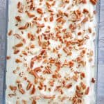 carrot cake with cream cheese frosting in a baking dish