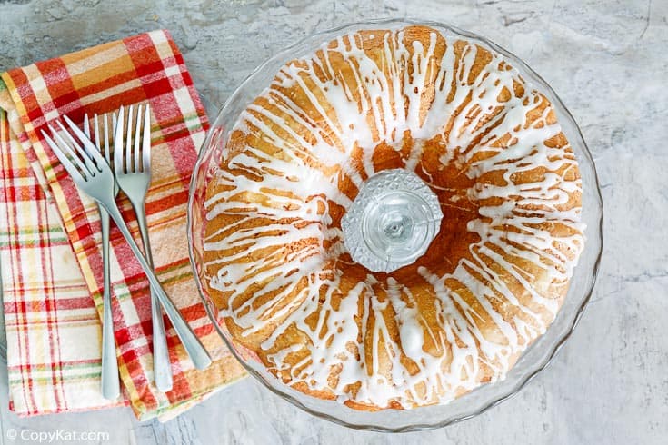 golden pound cake with forks and napkins next to it