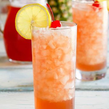 two glasses and a pitcher of homemade Joe's Crab Shack secret passion punch