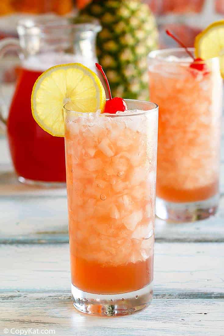 two glasses and a pitcher of homemade Joe's Crab Shack secret passion punch