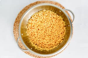 cooked elbow macaroni in a strainer
