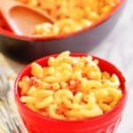 macaroni and cheese in a red bowl