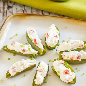 cream cheese filled fresh jalapeno peppers on a plate