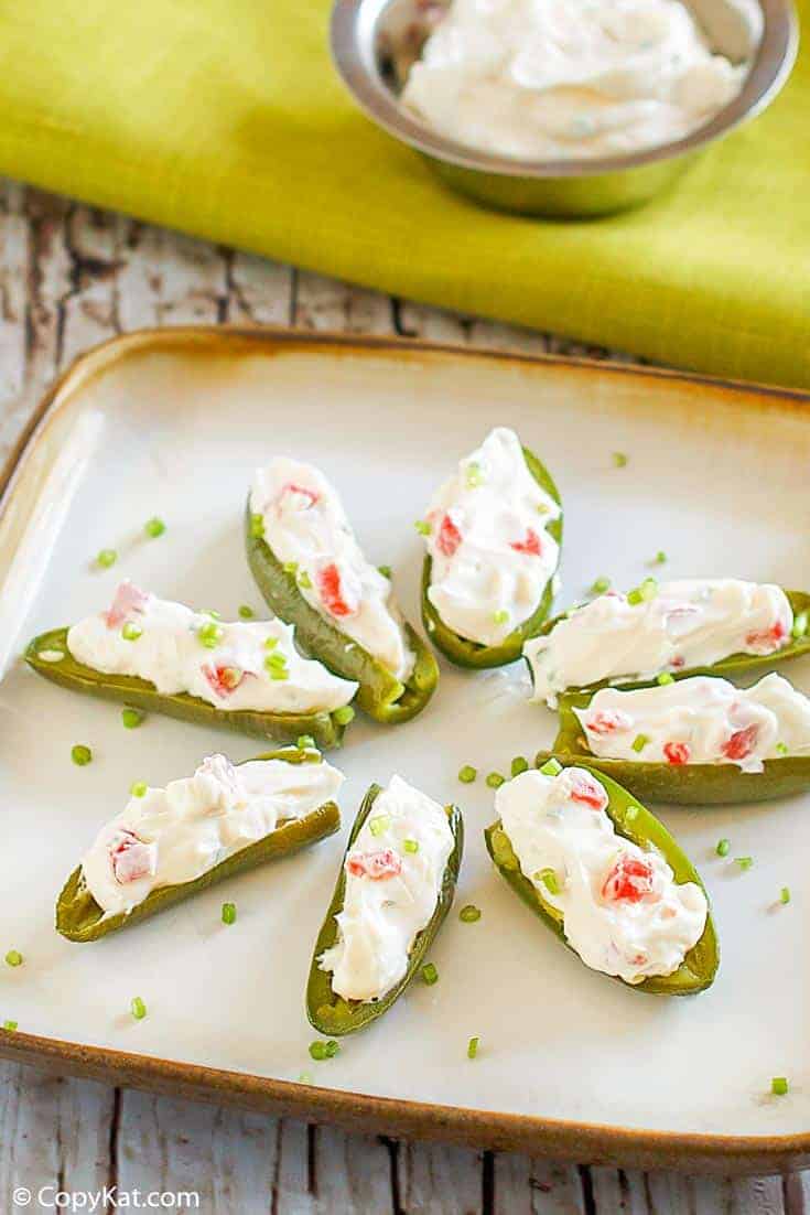 cream cheese filled pickled jalapeno peppers on a plate