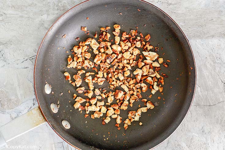 toasted walnuts in a skillet