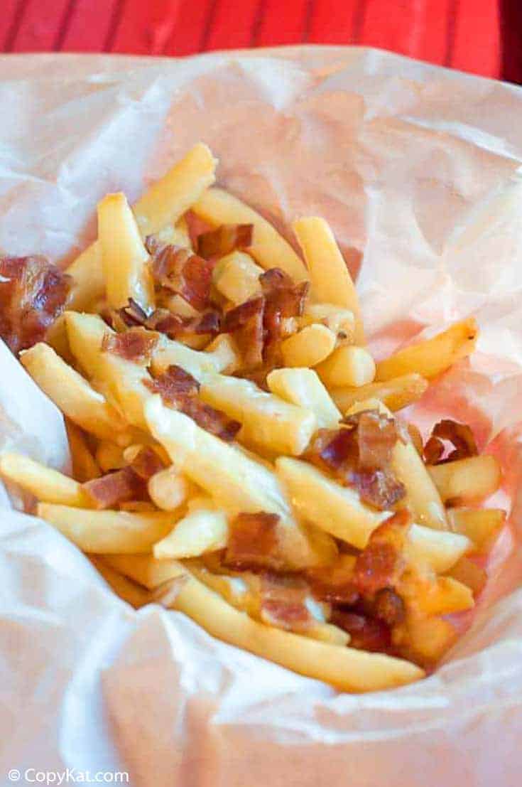 bacon fondue fries on parchment paper