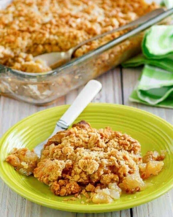 apple crisp in a baking dish and on a plate
