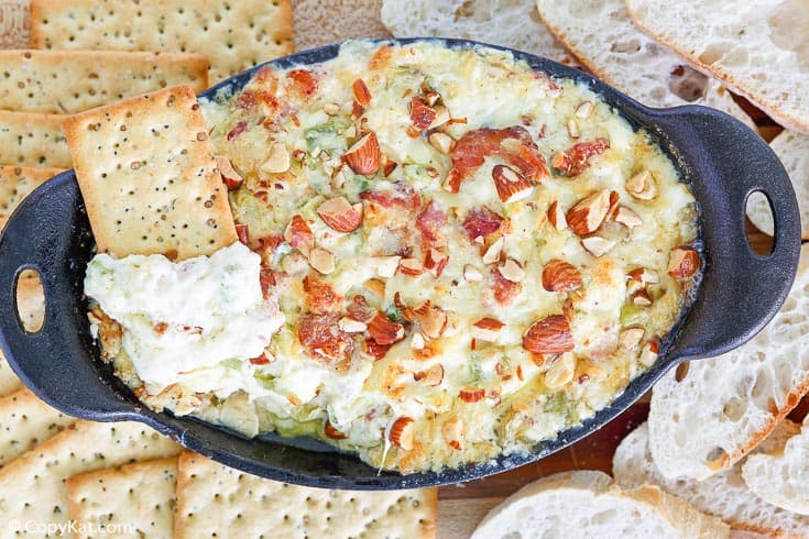 Bacon Swiss Dip served with crackers and bread slices