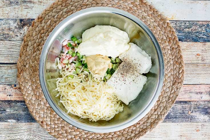 Bacon Swiss Dip ingredients in a mixing bowl