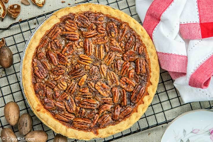 a whole pecan pie on a wire rack