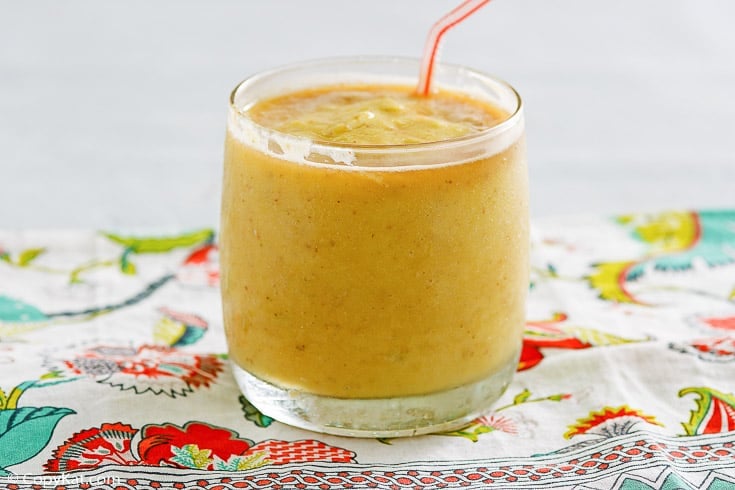 Dole whip with rum float and a straw in a glass