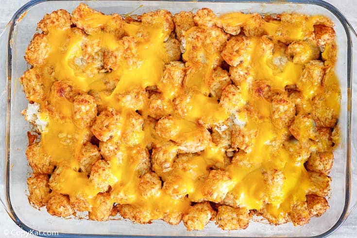 overhead view of hamburger tater tot casserole in a glass baking dish