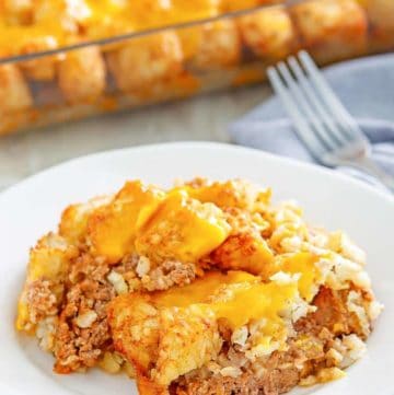 a serving of hamburger tater tot casserole on a white plate