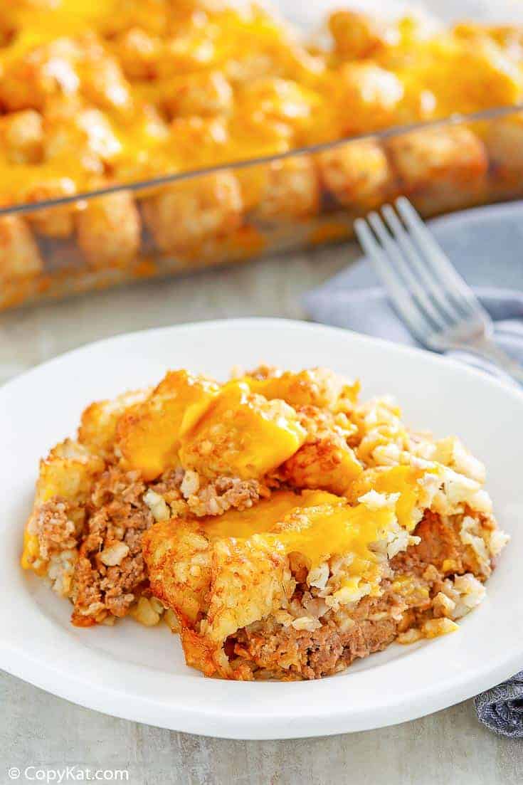 a serving of hamburger tater tot casserole on a white plate
