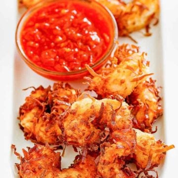 Homemade Joes Coconut Shrimp and dipping sauce on a platter