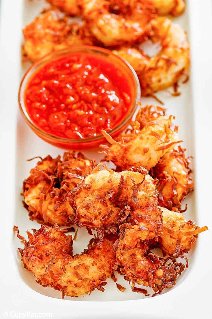 Homemade Joes Coconut Shrimp and dipping sauce on a platter