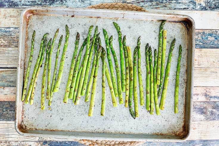 roasted asparagus on a baking sheet