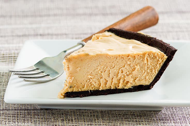 a slice of peanut butter pie and a fork on a plate