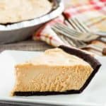 a slice of peanut butter pie with chocolate cookie crust