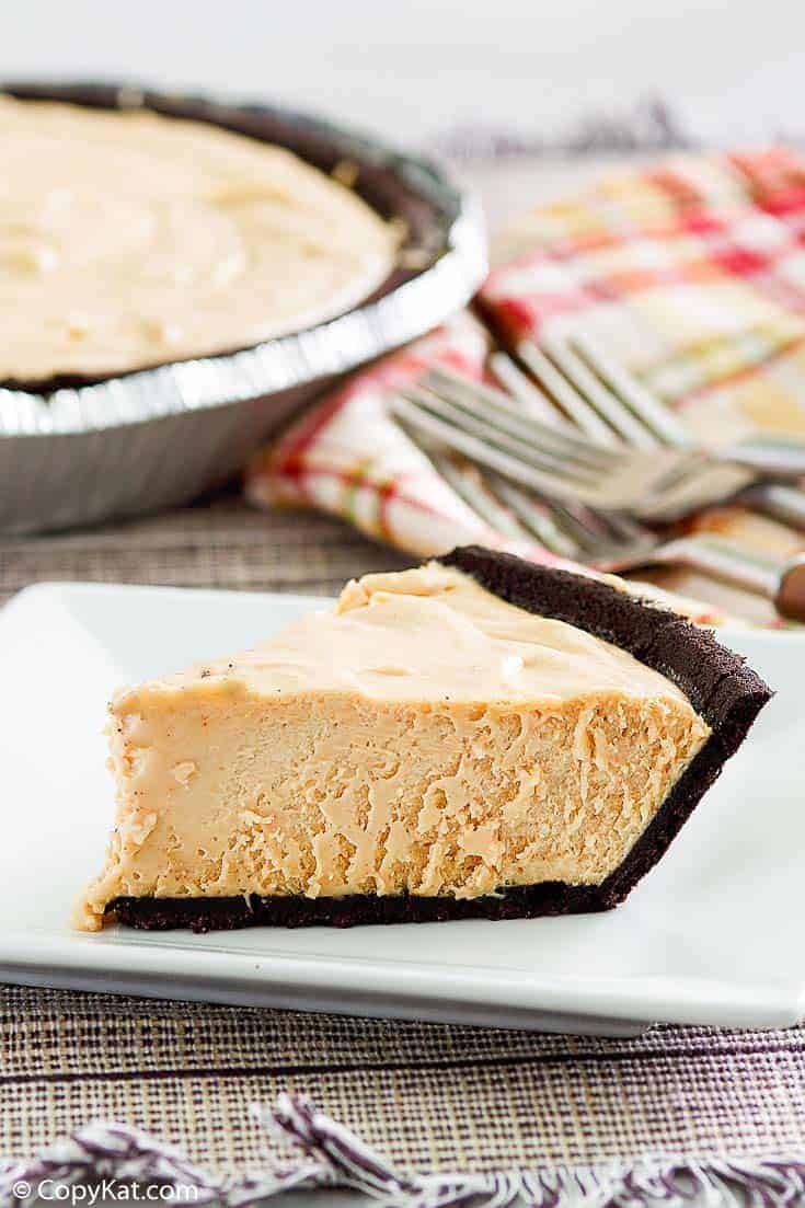 a slice of peanut butter pie with chocolate cookie crust